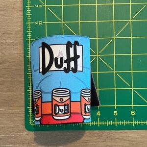 The Simpsons Duff Man Beer Coozie & The Simpsons Logo Pilsner Glass Acrylic